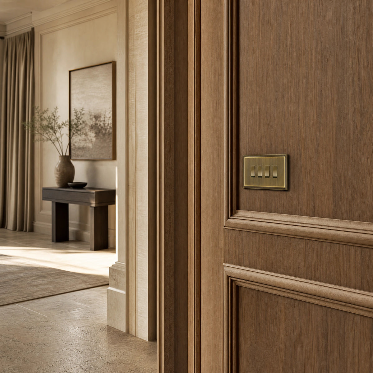 Luxury antique brass rocker switch installed within feature wall beside an elegant doorway with refined timber panelling in a UHNW interior by VORELLI®.