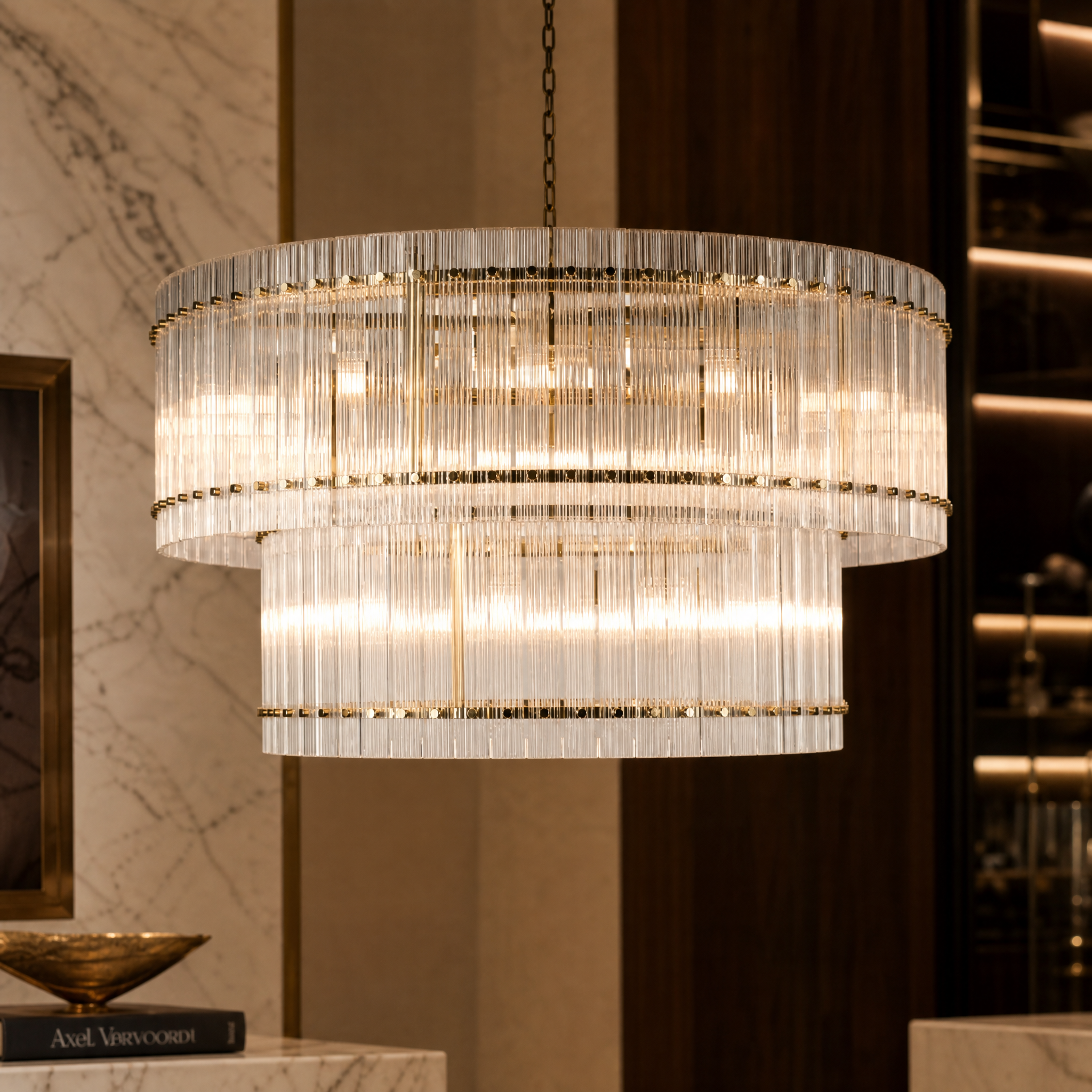 A detailed closeup of the VORELLI Sanvino chandelier, highlighting the ribbed glass panes and the intricate studded brass frame.