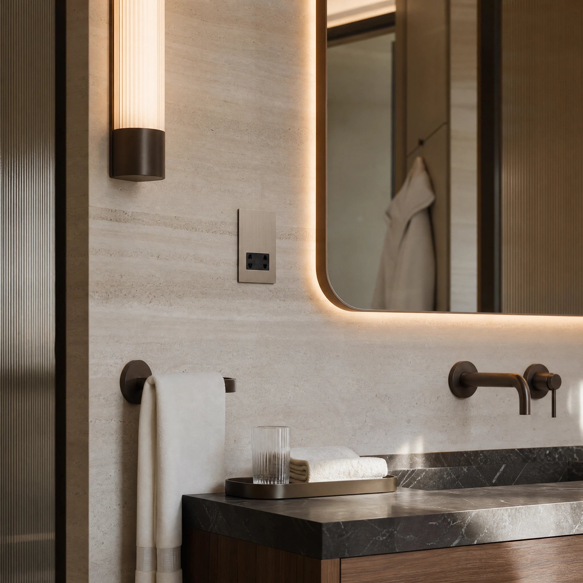 Luxury roma shaver socket installed within five-star hotel bathroom vanity with marble wall and soft mirror lighting in a UHNW interior by VORELLI®.