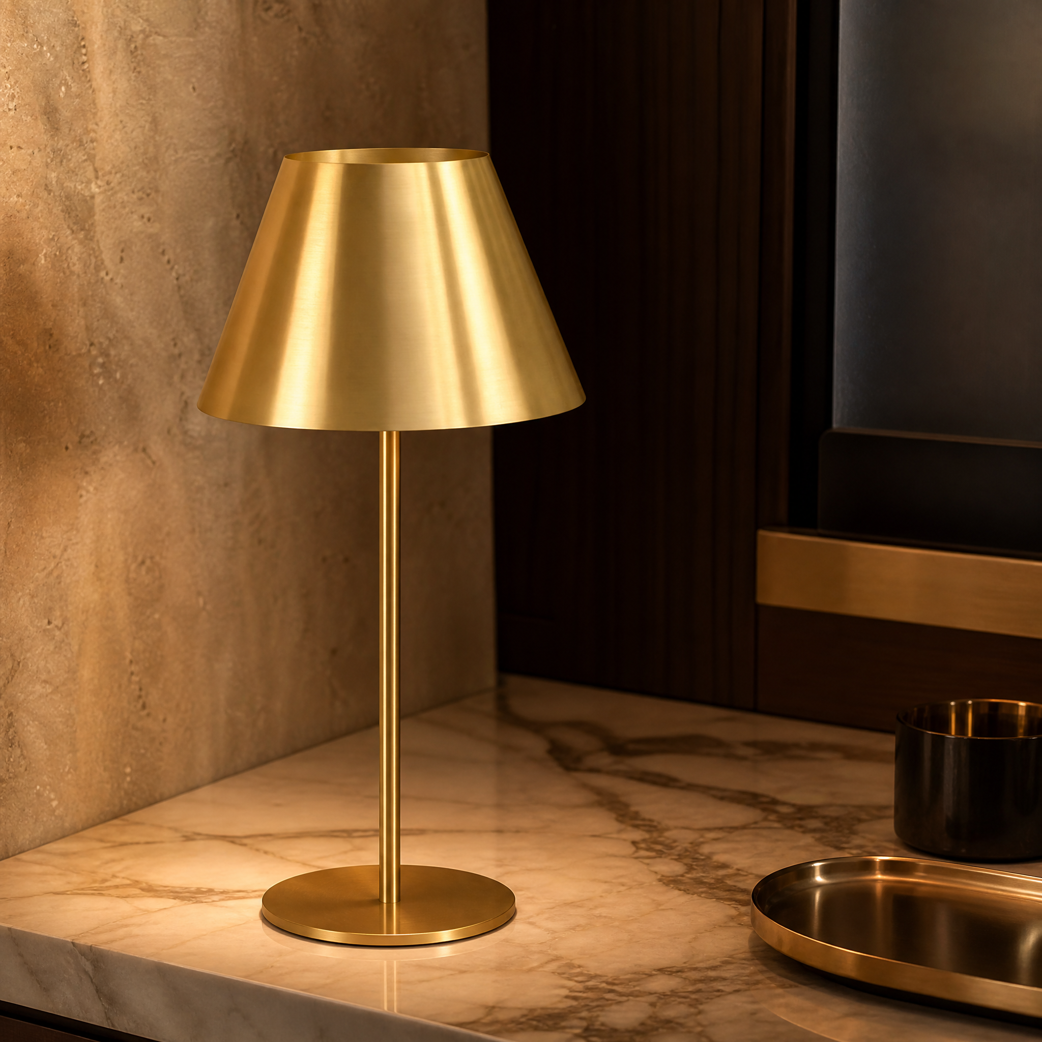 Detailed closeup of the VORELLI Solvane table lamp showing its sleek tapered silhouette and refined antique brass finish texture.
