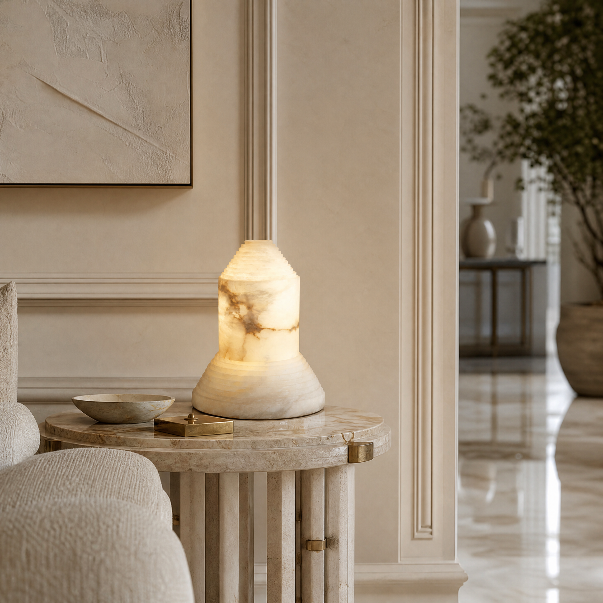 VORELLI Stratto Marble Table Lamp casting a warm glow in a beautifully styled luxury residential living room.