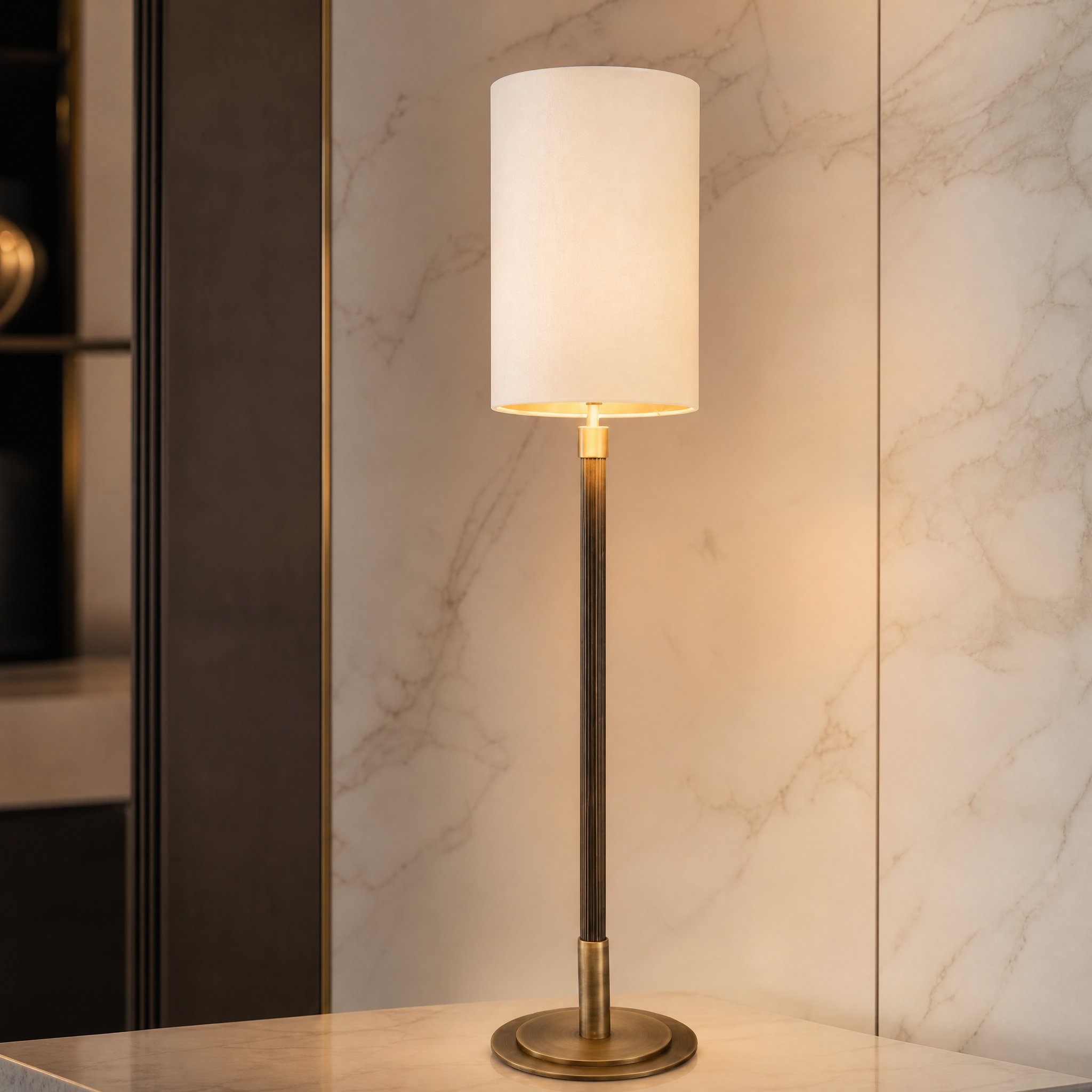 Detailed closeup of the VORELLI Tavero table lamp highlighting its slender antique brass silhouette and premium opal glass shade.