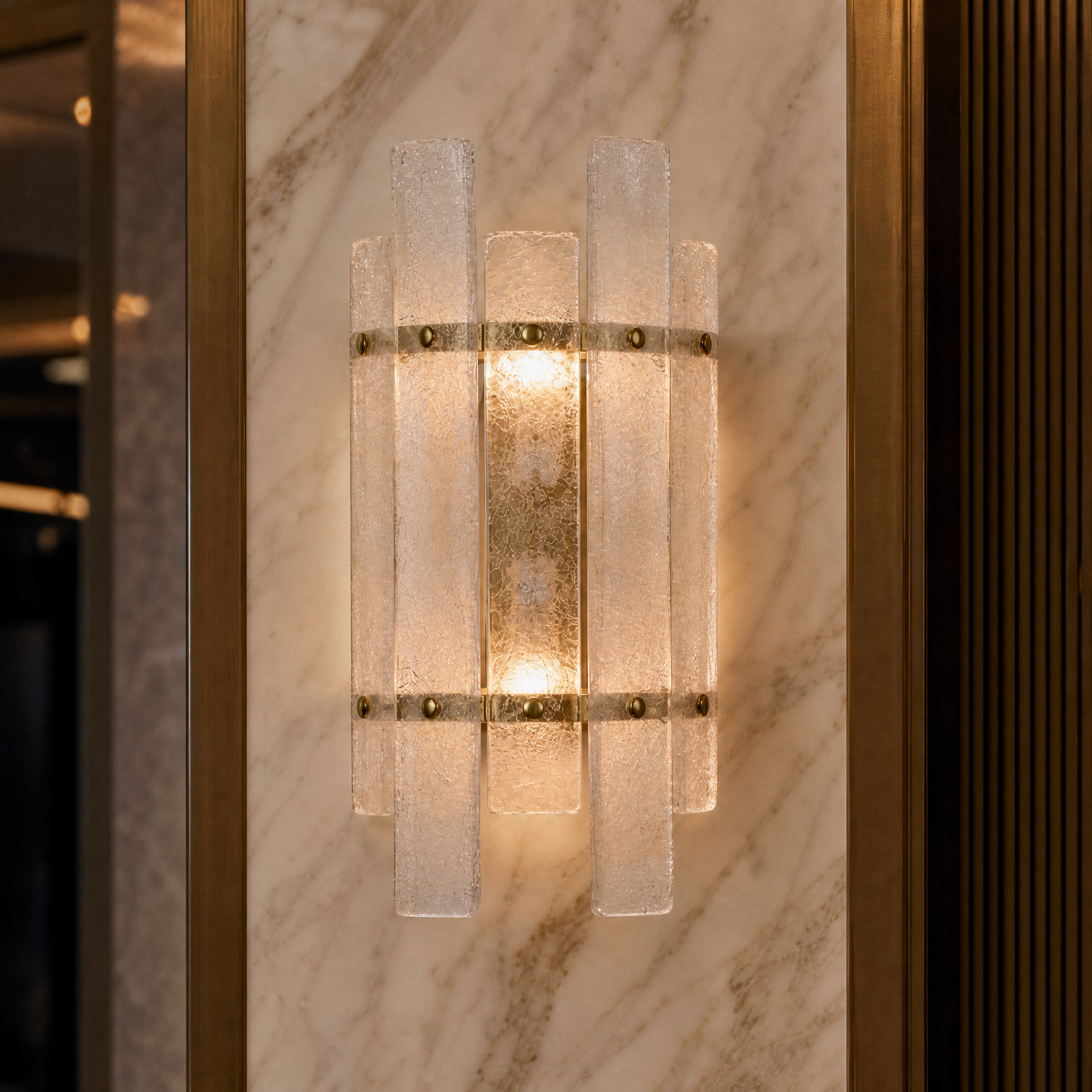 A crisp, detailed close-up showing the refined texture of the Tavolino light's crackled glass panels and minimal brass finishes.