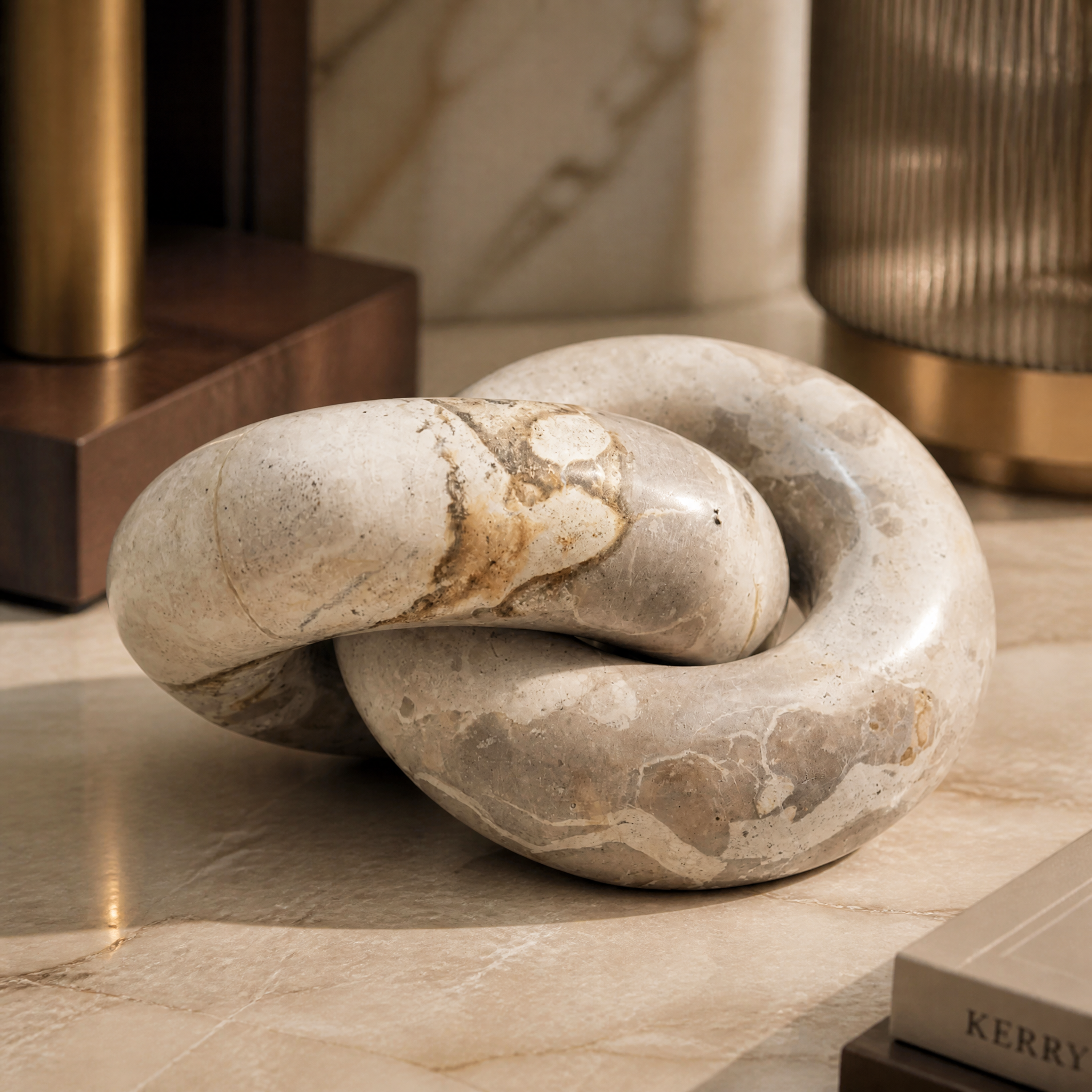 Close-up shot of the VORELLI Torrino Beige Link Decor showcasing the smooth marble surface texture and intricate interlocking design.