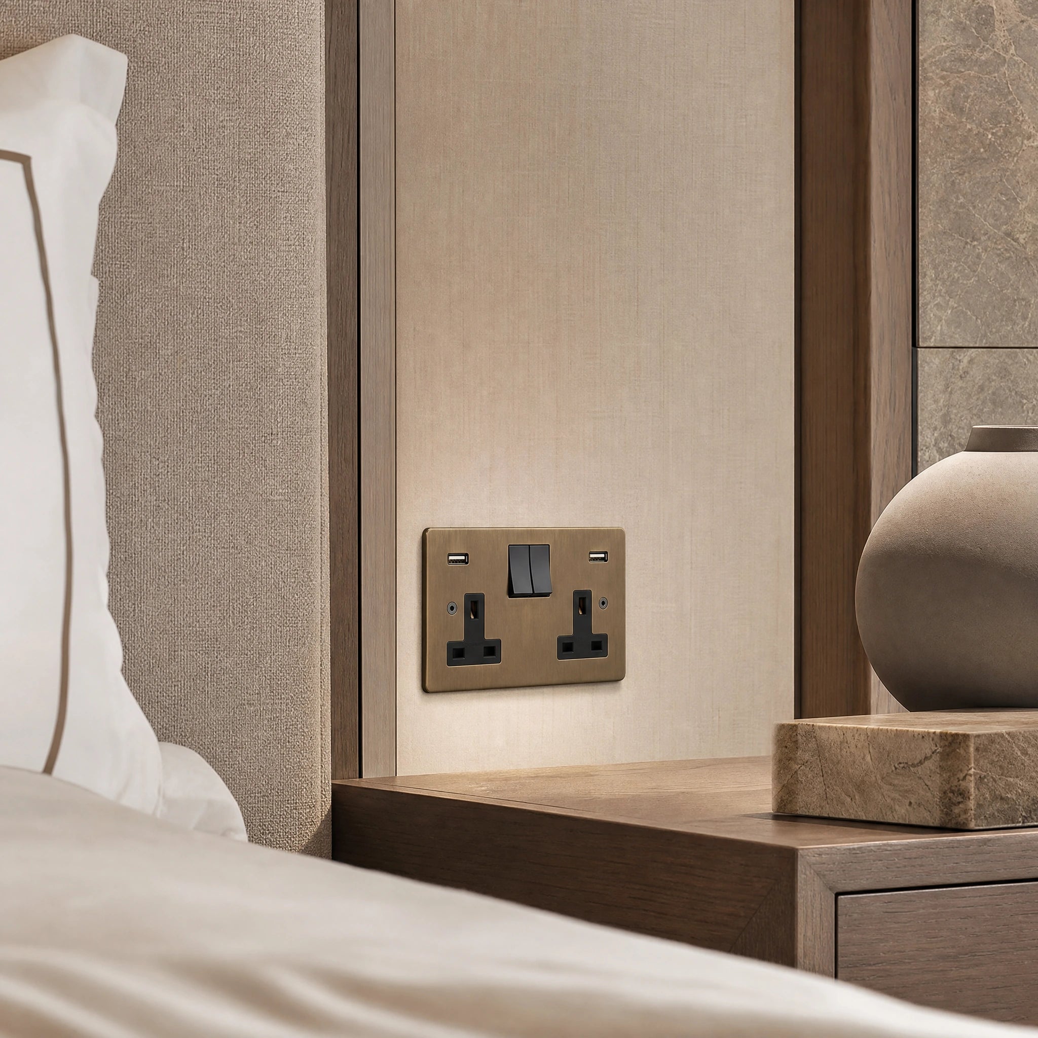 Luxury antique brass usb socket installed within bespoke bedside joinery in a luxury bedroom suite in a UHNW interior by VORELLI®.