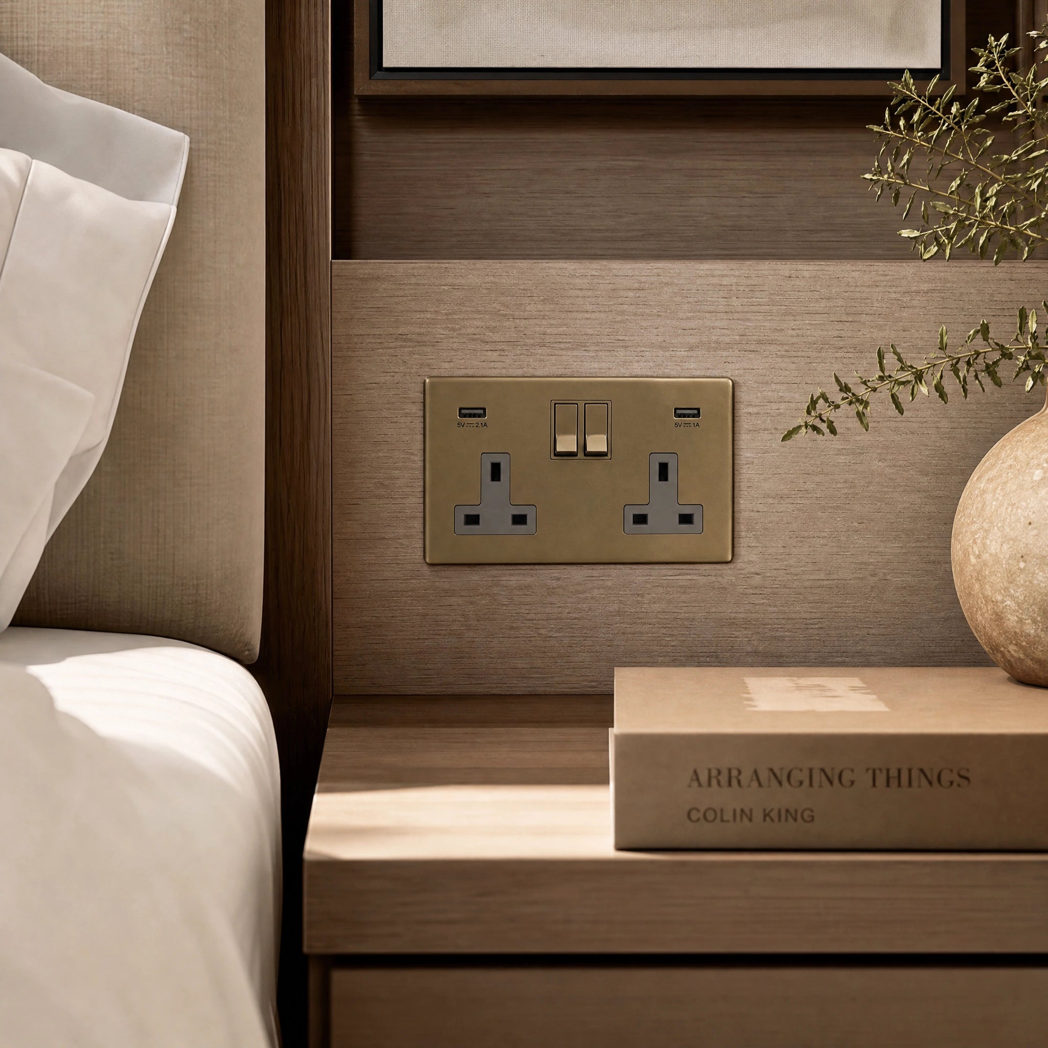 Luxury antique brass usb socket installed within bespoke bedside joinery in a luxury bedroom suite in a UHNW interior by VORELLI®.
