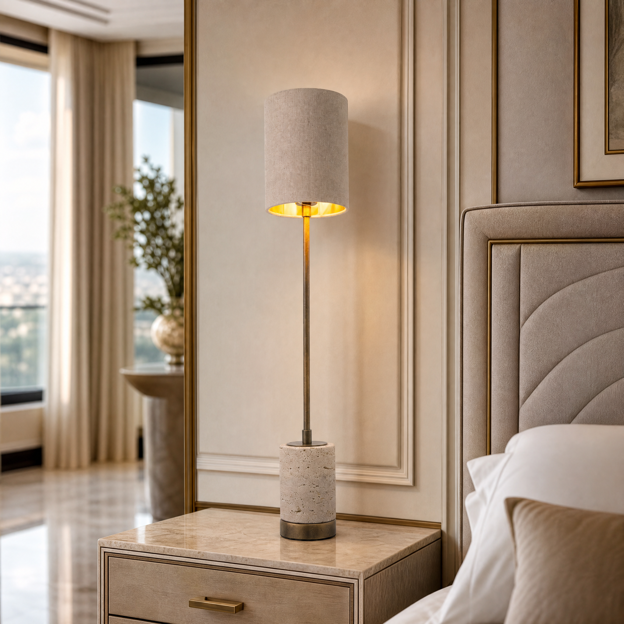 VORELLI Valmere H63 brass table lamp with a natural travertine stone base and white linen shade illuminating a luxury residential living room console table.