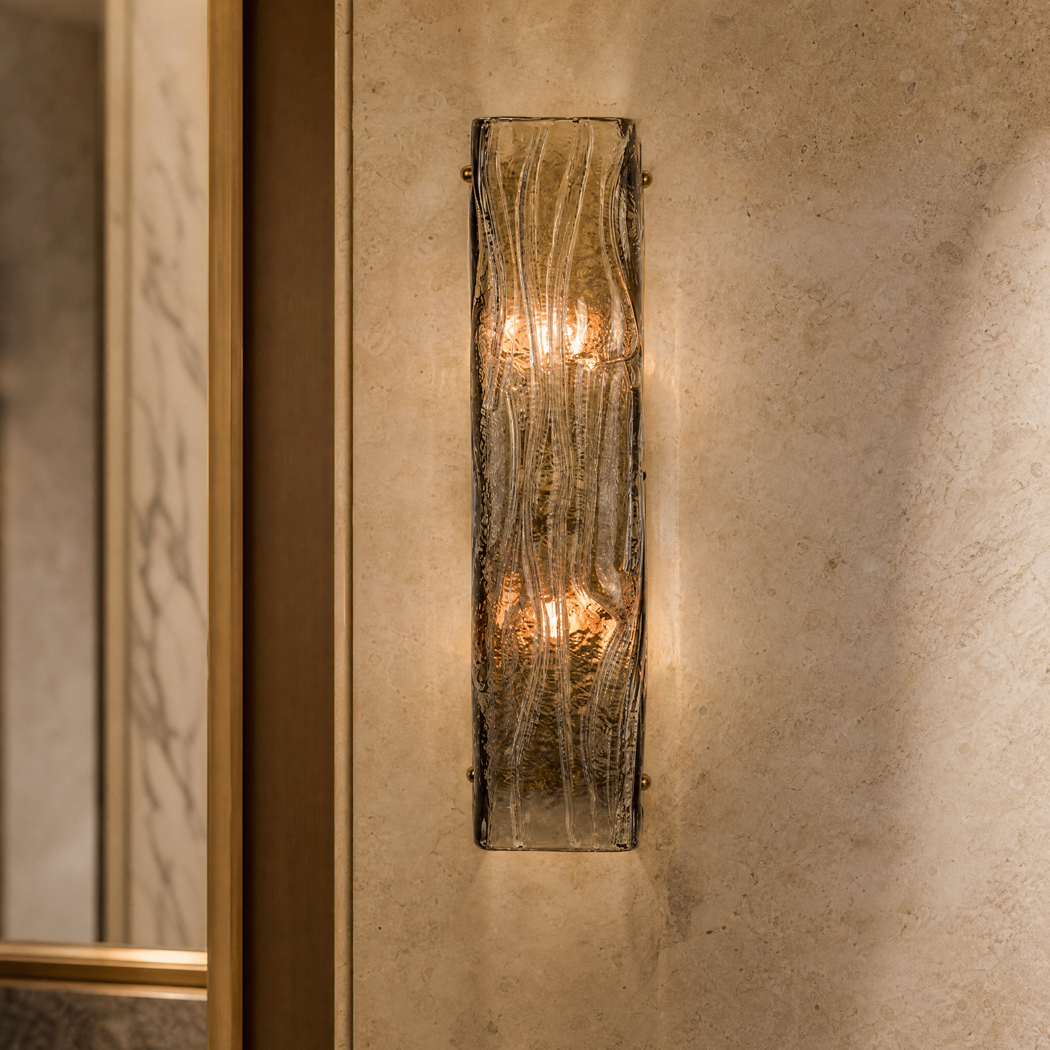 Macro closeup of the VORELLI Vialone Wall Light highlighting the rippled square pale smoked glass frame and brass sphere screw details.
