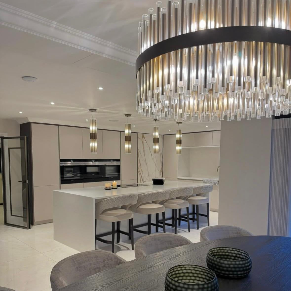 Crystal pendant lighting creating refined ambiance in luxury dining room interior