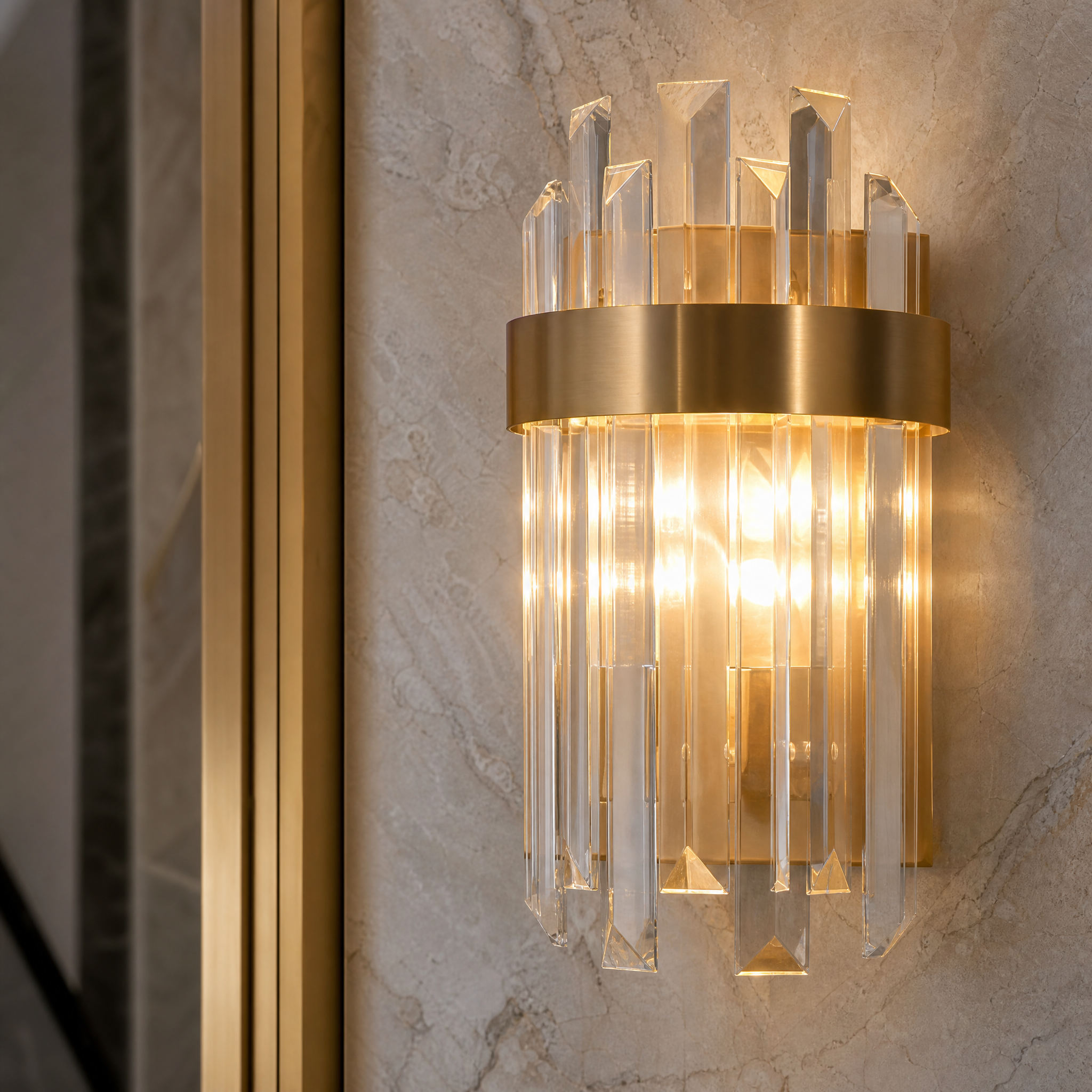 Macro closeup of the VORELLI Williston wall light, highlighting the intricate texture of the premium crystal bars and the polished finish of its stainless steel frame.