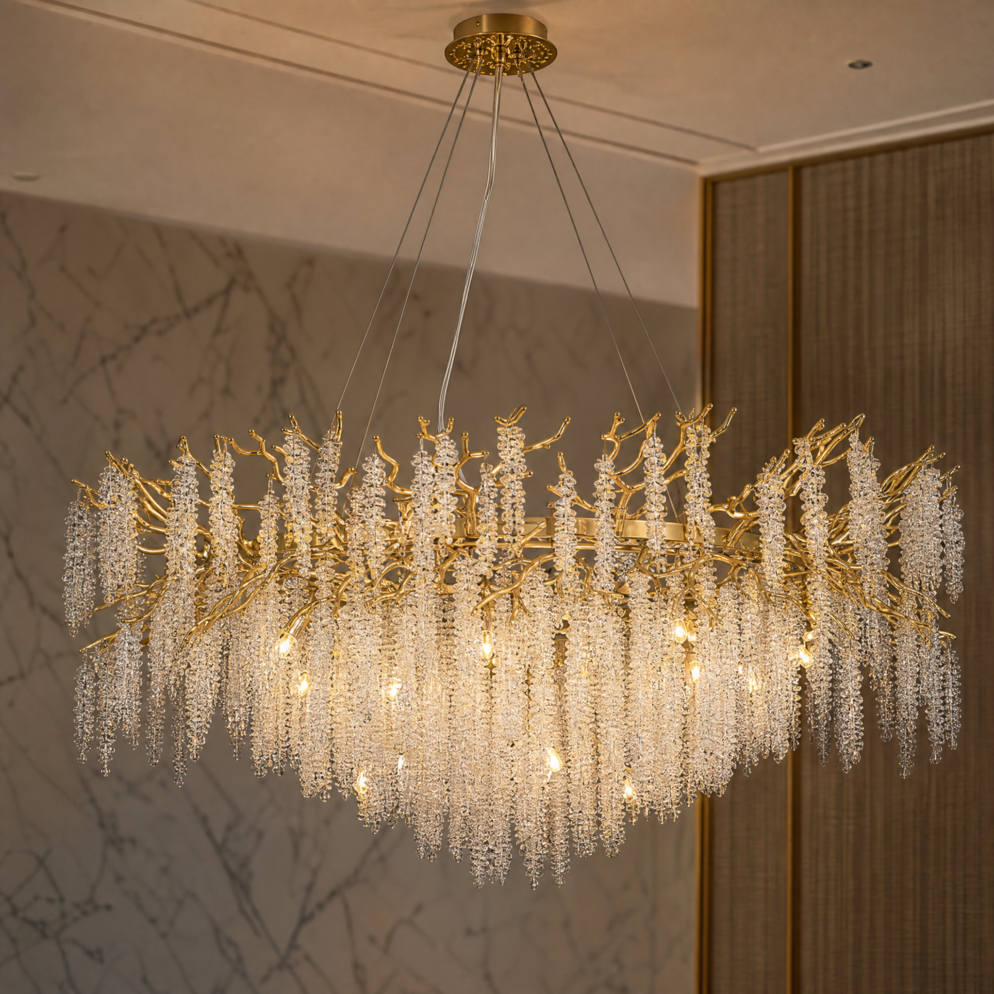 Macro shot of the VORELLI Wisteria Chandelier showcasing the intricate details of the crystal strands and organic branch form.