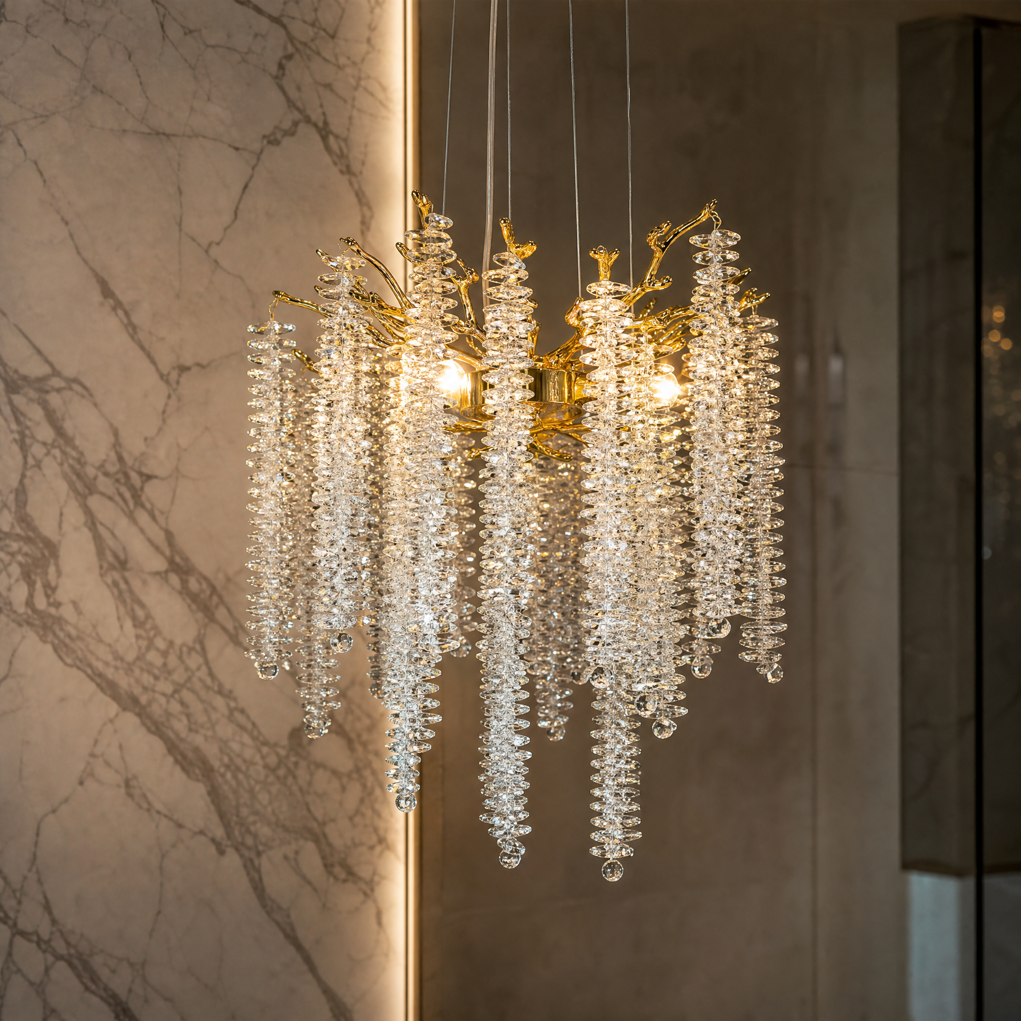 A detailed closeup of the VORELLI Wisteria pendant light, highlighting the intricate diamond cut crystals and flowing silhouette.