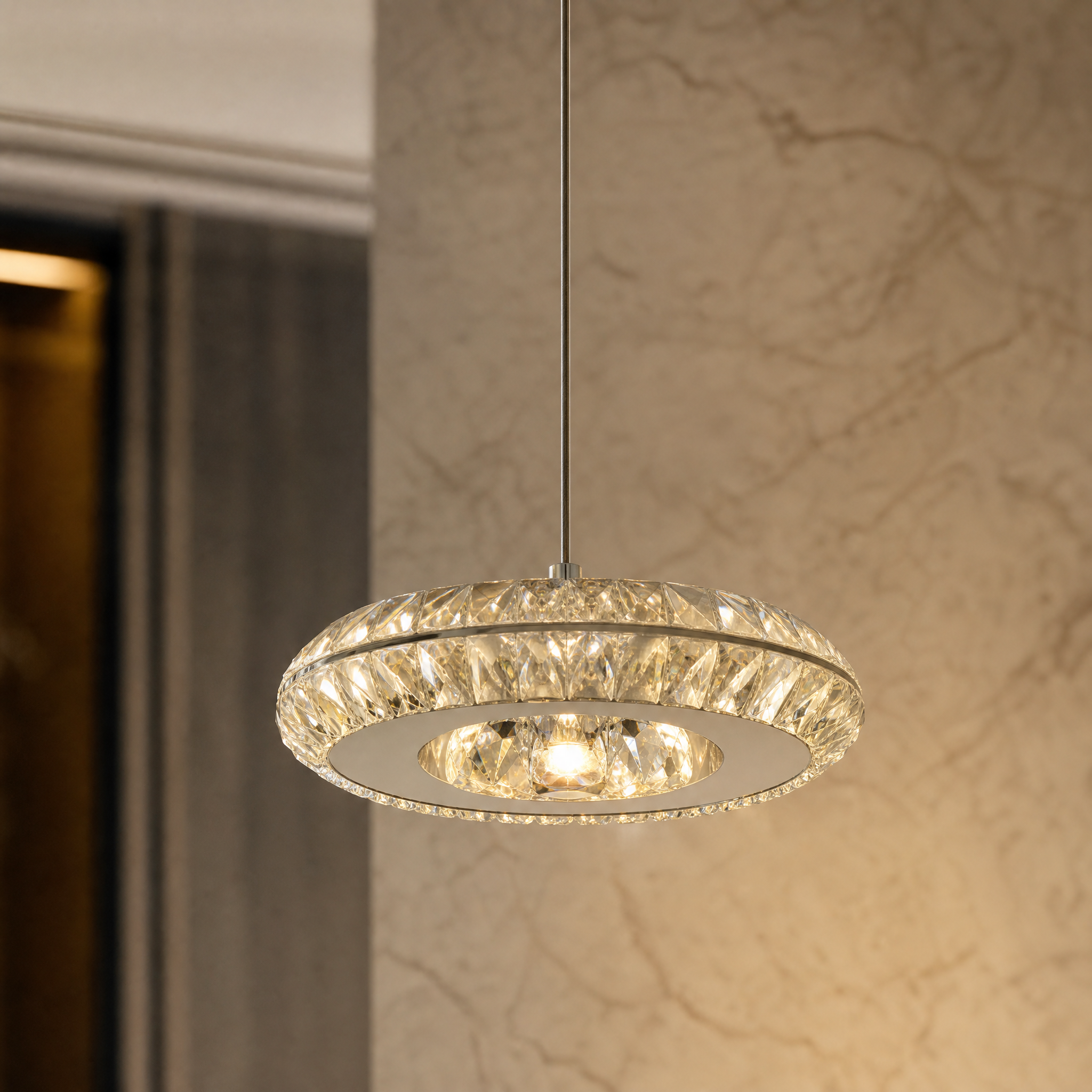 Macro closeup showing the intricate details of the diamond cut crystal and minimalist design on the VORELLI Zaffiri pendant light.