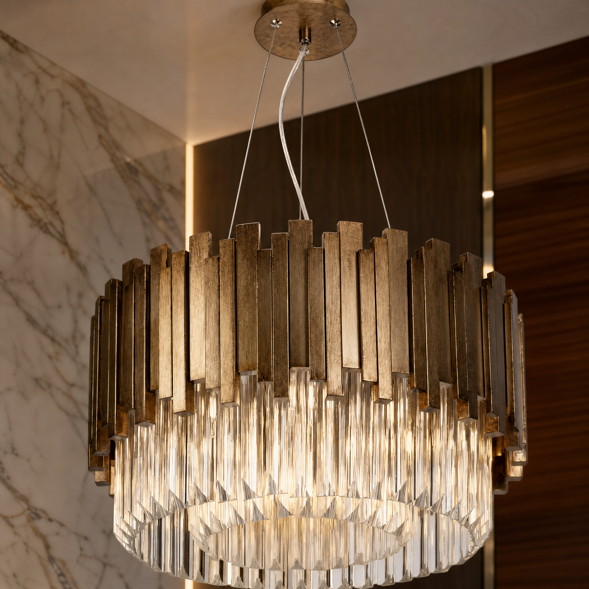 A detailed closeup of the VORELLI Zanero Chandelier, showcasing the intricate faceted crystal prisms and sleek vertical metal bars that add depth and brilliance.