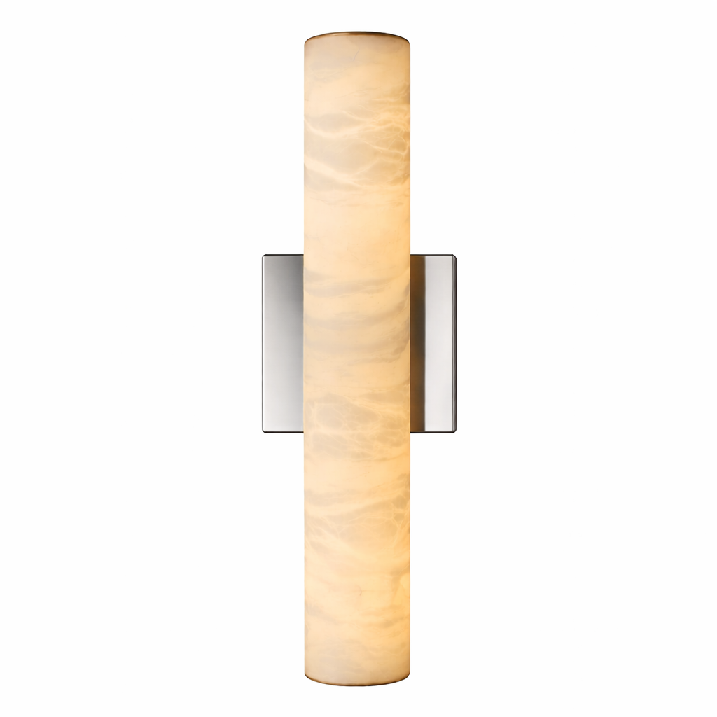 Warm, atmospheric illumination emanating from the luxury Velato cylindrical marble sconce, perfect for high-end interior styling.