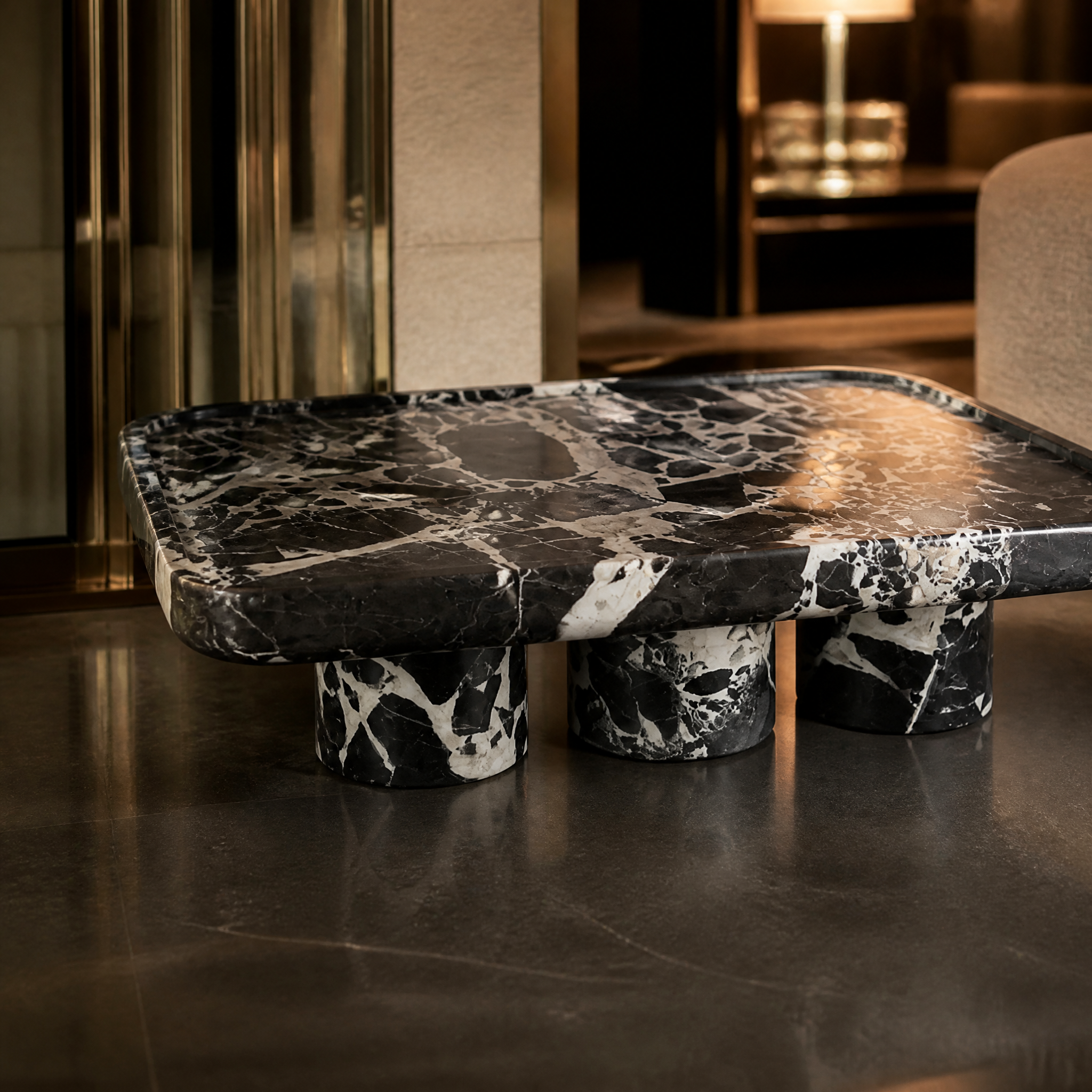 Wide view of Xaviero coffee table showing sharp architectural silhouette.