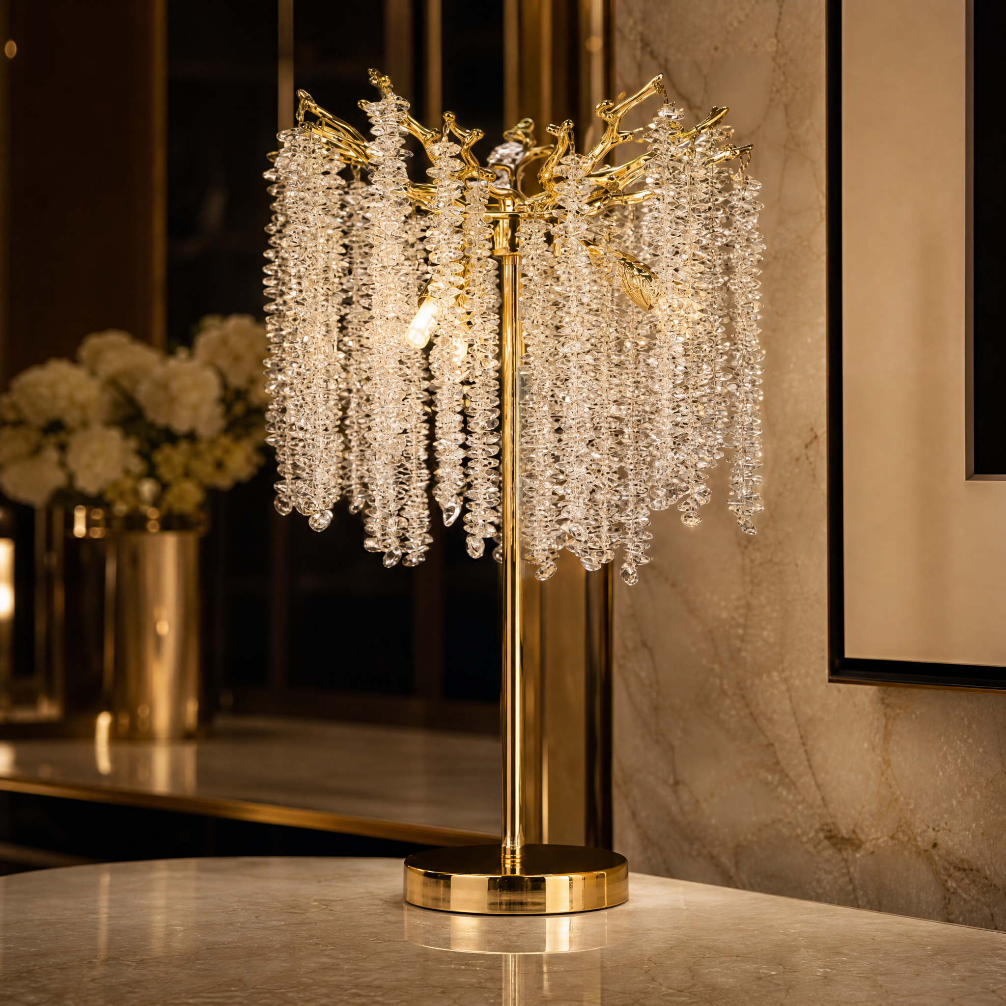 Macro closeup of the VORELLI Wisteria table lamp, showcasing delicate crystal strands cascading from the intricate, sculpted branch-inspired metal frame.