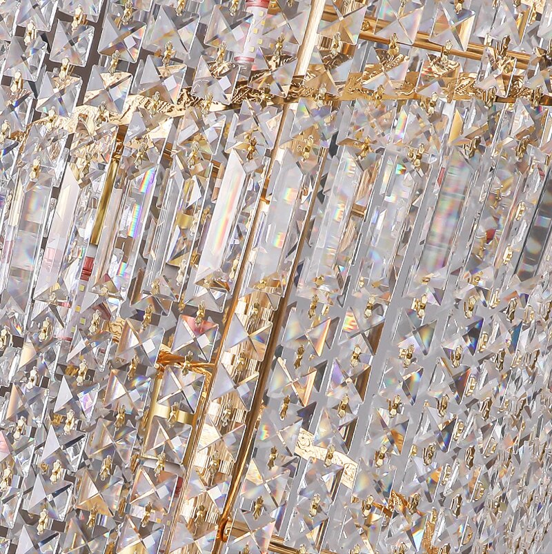 Detailed view of Basilgio chandelier’s faceted crystal strands creating radiant light play.