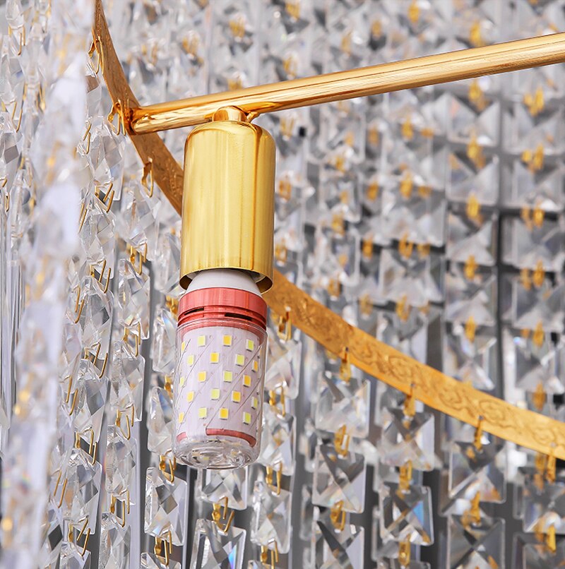 Gold-finished frame of the Basilgio chandelier with precision-mounted crystal rods.