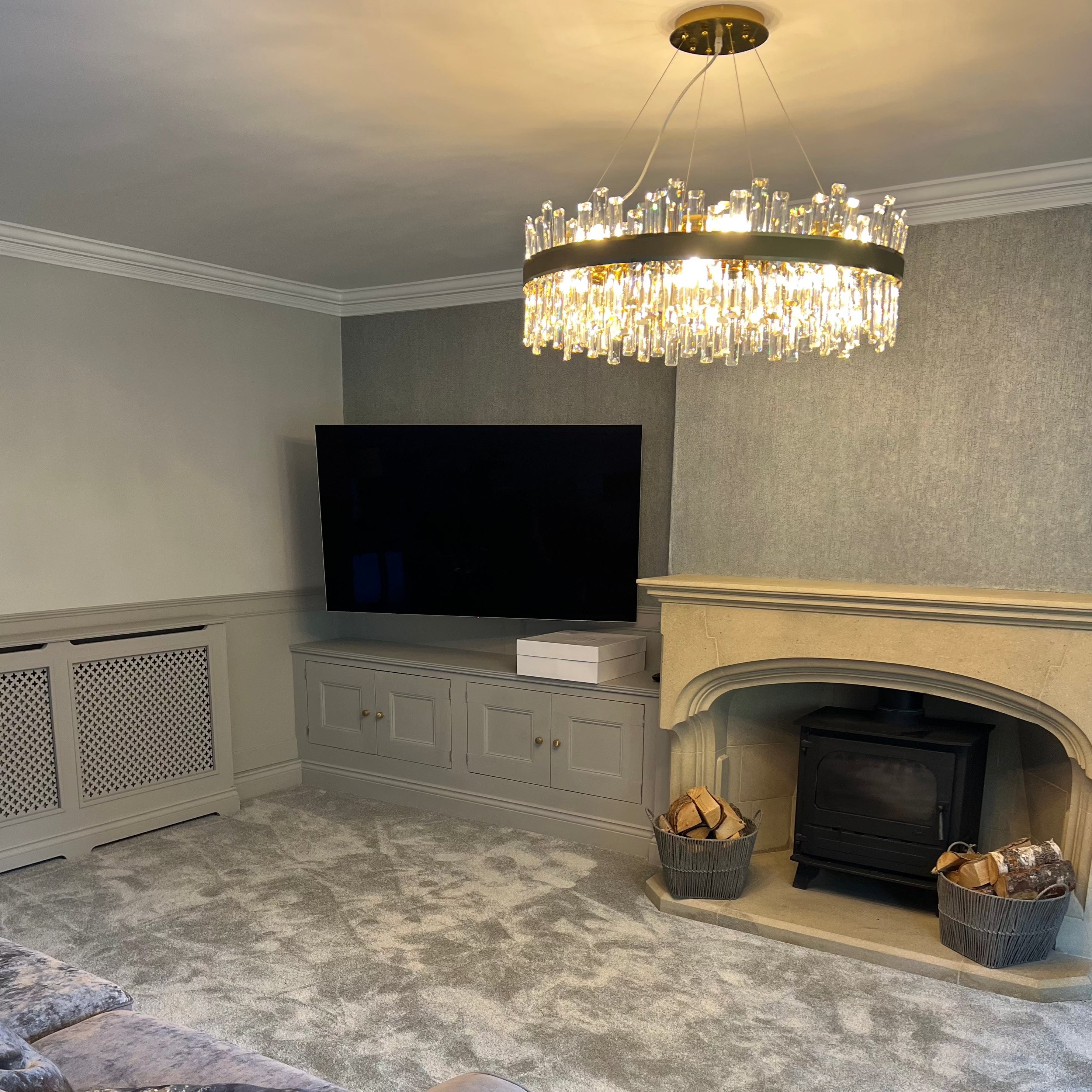 Brighouse Circular Chandelier illuminating a contemporary living space with warm ambient lighting.