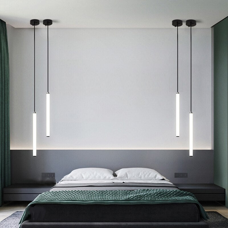 cowley pendant lights suspended above modern bedroom with minimalist design