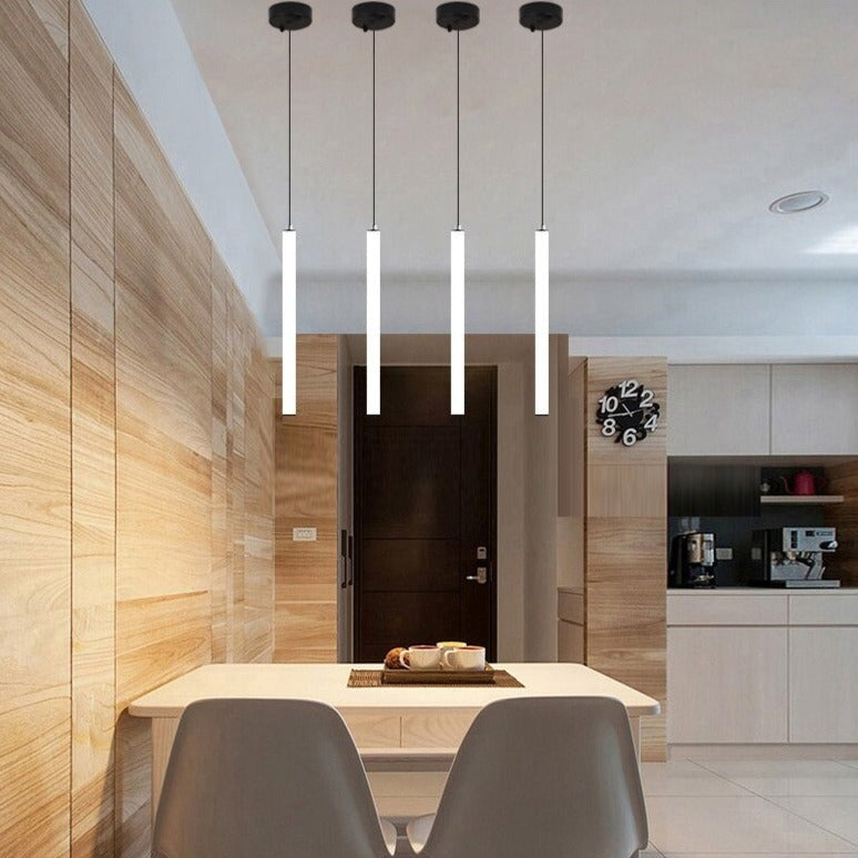 cowley pendant lights arranged above dining table in modern interior