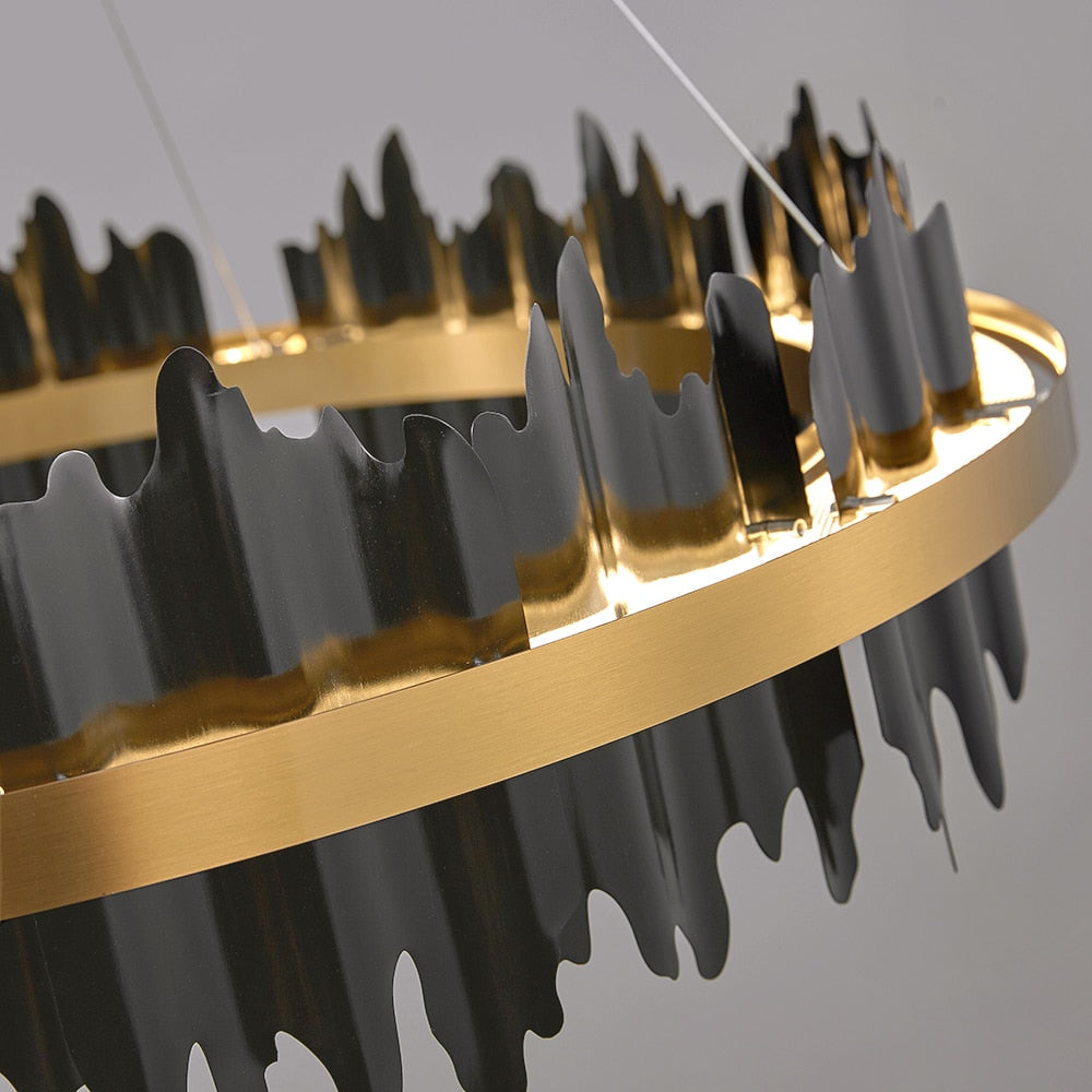 Close-up of gold frame and sculptural fins on the Douala Double Circular Chandelier