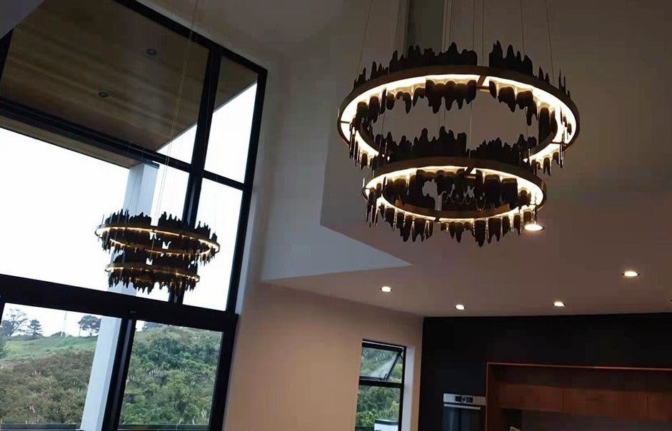Douala Double Circular Chandelier illuminating a contemporary interior with bold cultural design
