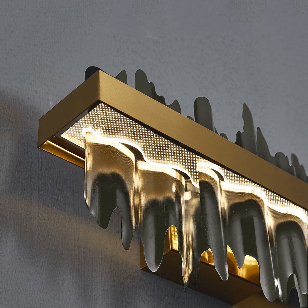 Close-up of gold frame and sculptural fin details on the Douala Rectangular Chandelier