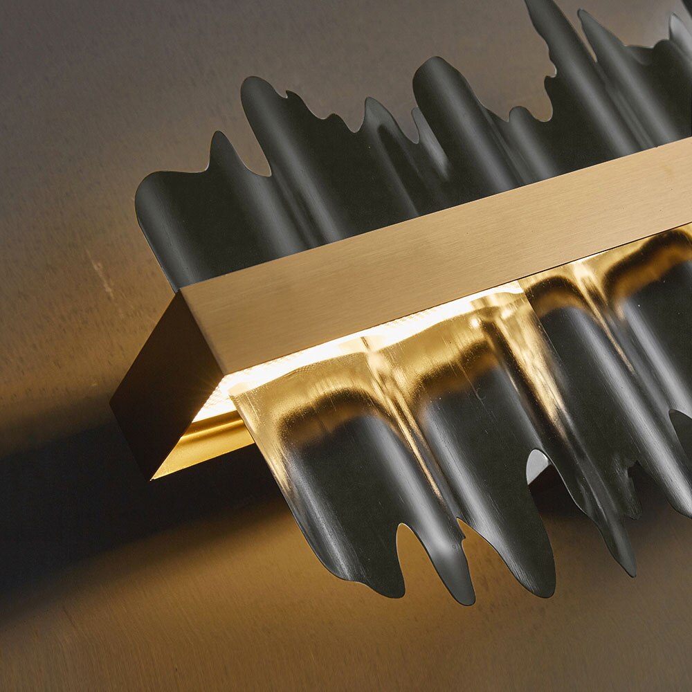 Side angle featuring the textured fins and modern cultural design of the Douala Rectangular Chandelier