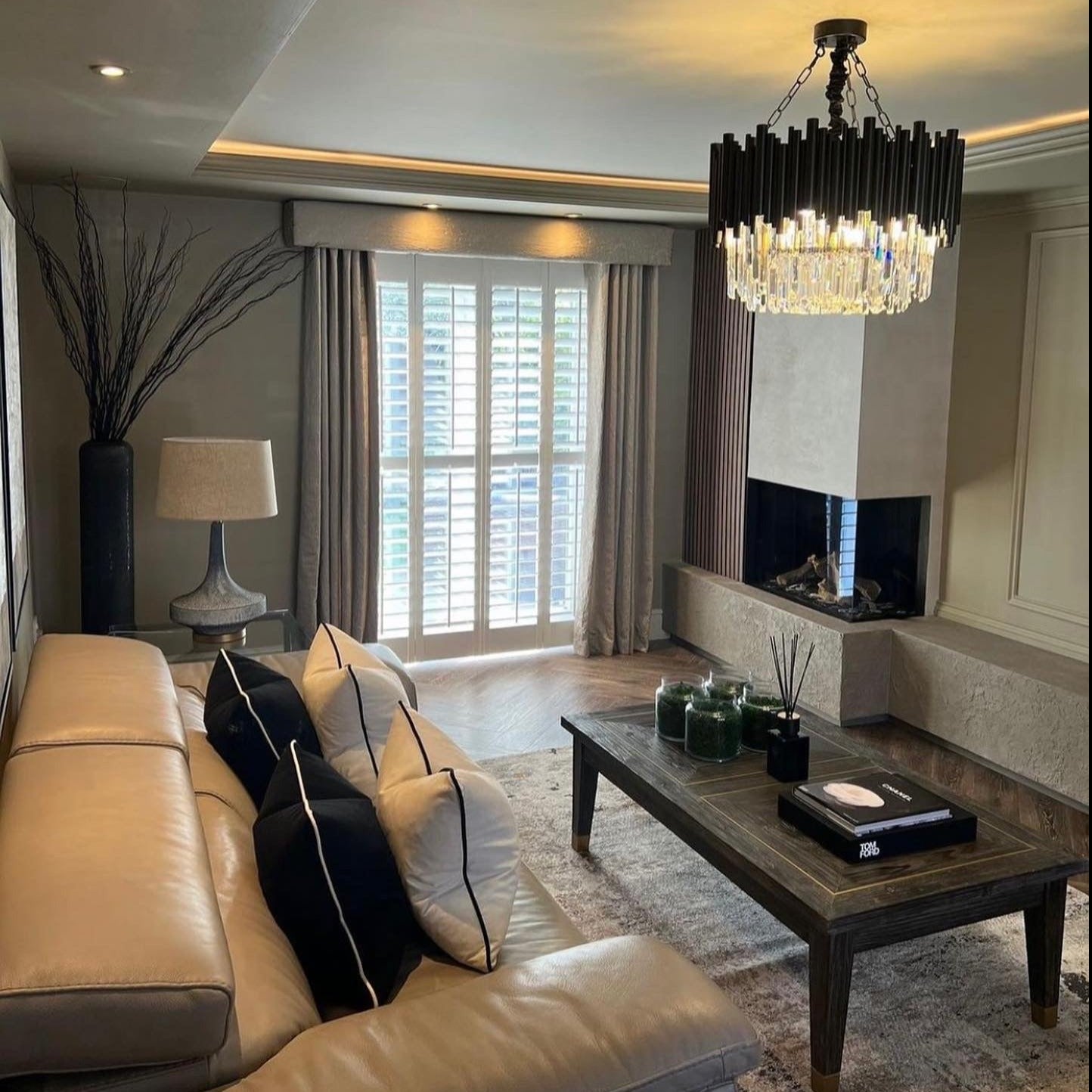 Modern living space featuring the VORELLI® Gotham Circular Chandelier.