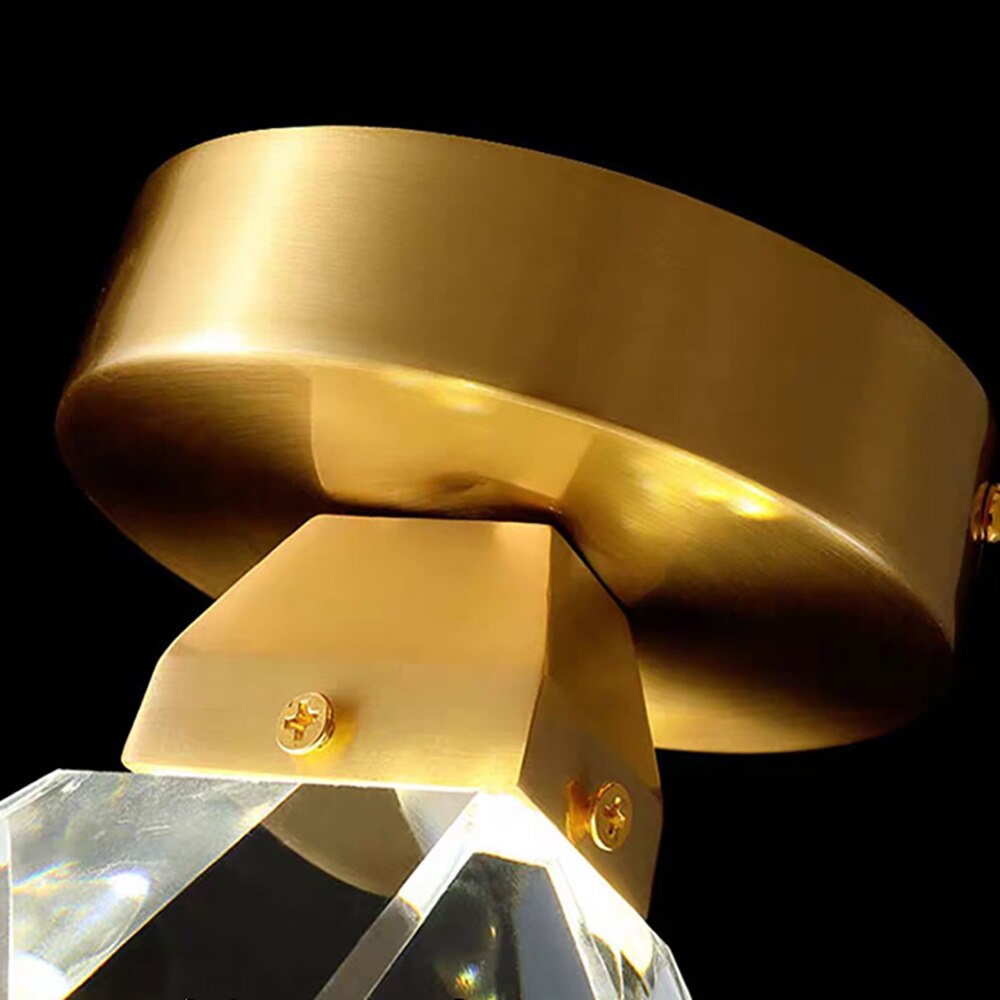 Close up angled view of diamond cut crystal sphere and ceiling canopy on Runtz flush crystal ceiling light