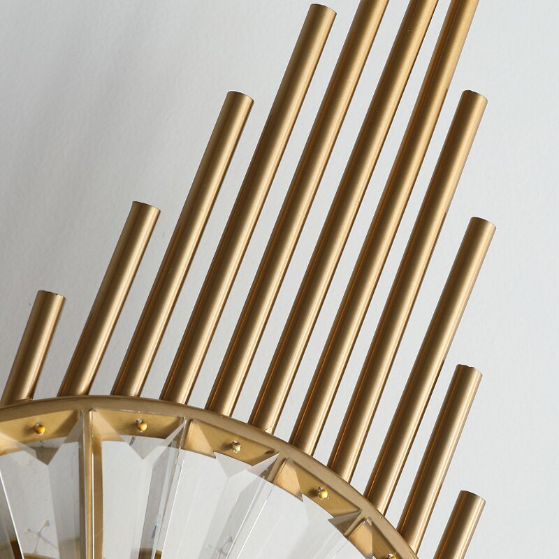 Detailed view of radial metal tubing design on Santa Maria crystal wall light