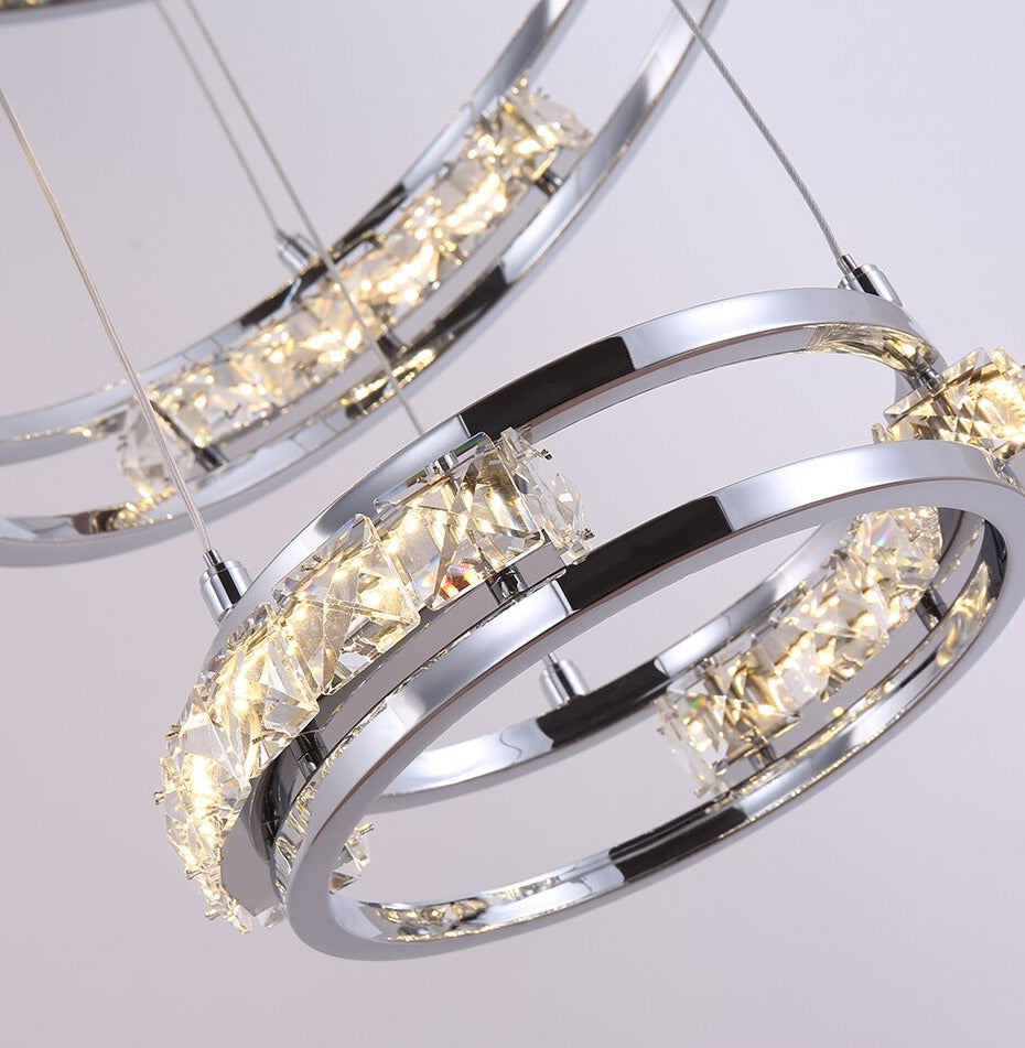 Detailed view of suspended spiral ring structure forming the Vermacelli luxury staircase chandelier by VORELLI