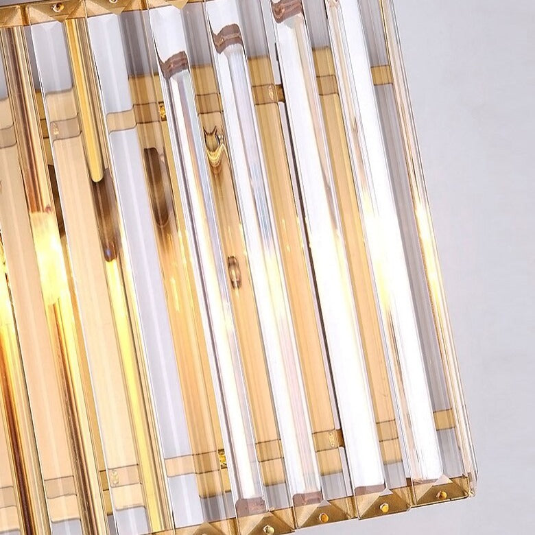 Close-up of gold and clear crystal bar detailing on the Alora wall light, highlighting premium craftsmanship.