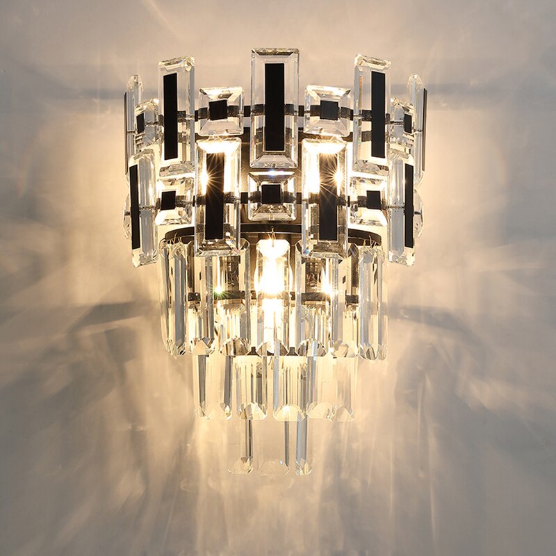 Front view of the Belvedere wall light showcasing its layered crystal arrangement.