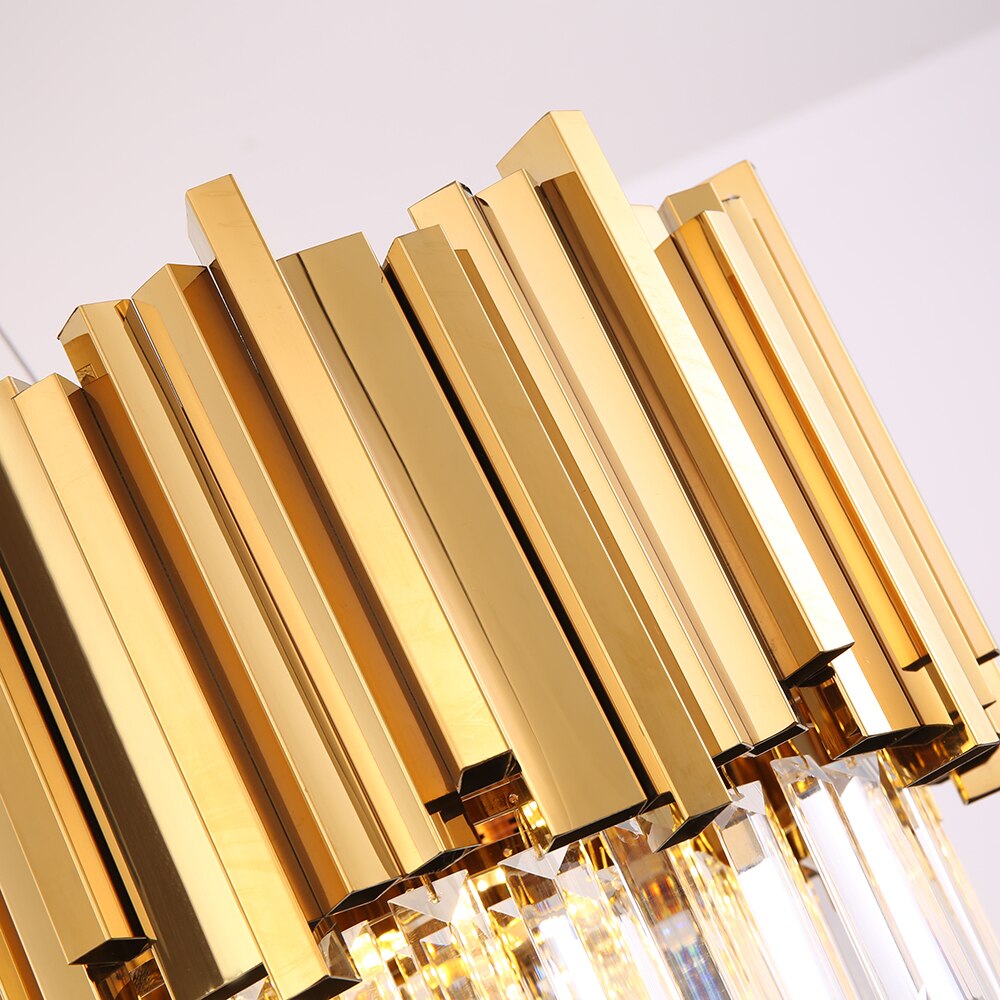 Macro view of the Boeotia Rectangular Chandelier’s polished gold cuboid tubing.