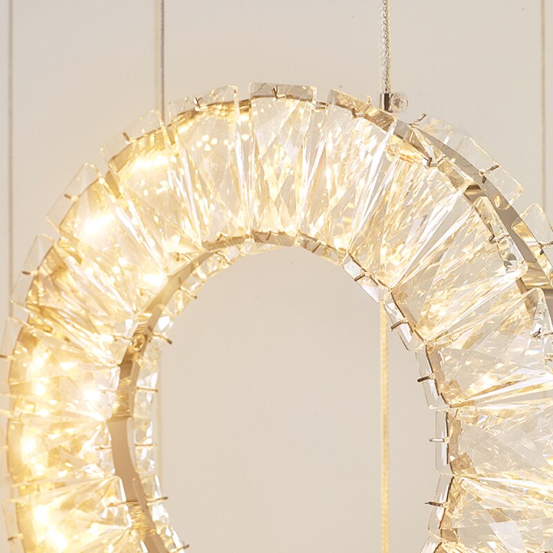 Illuminated crystal ring pendant on Farnham staircase chandelier