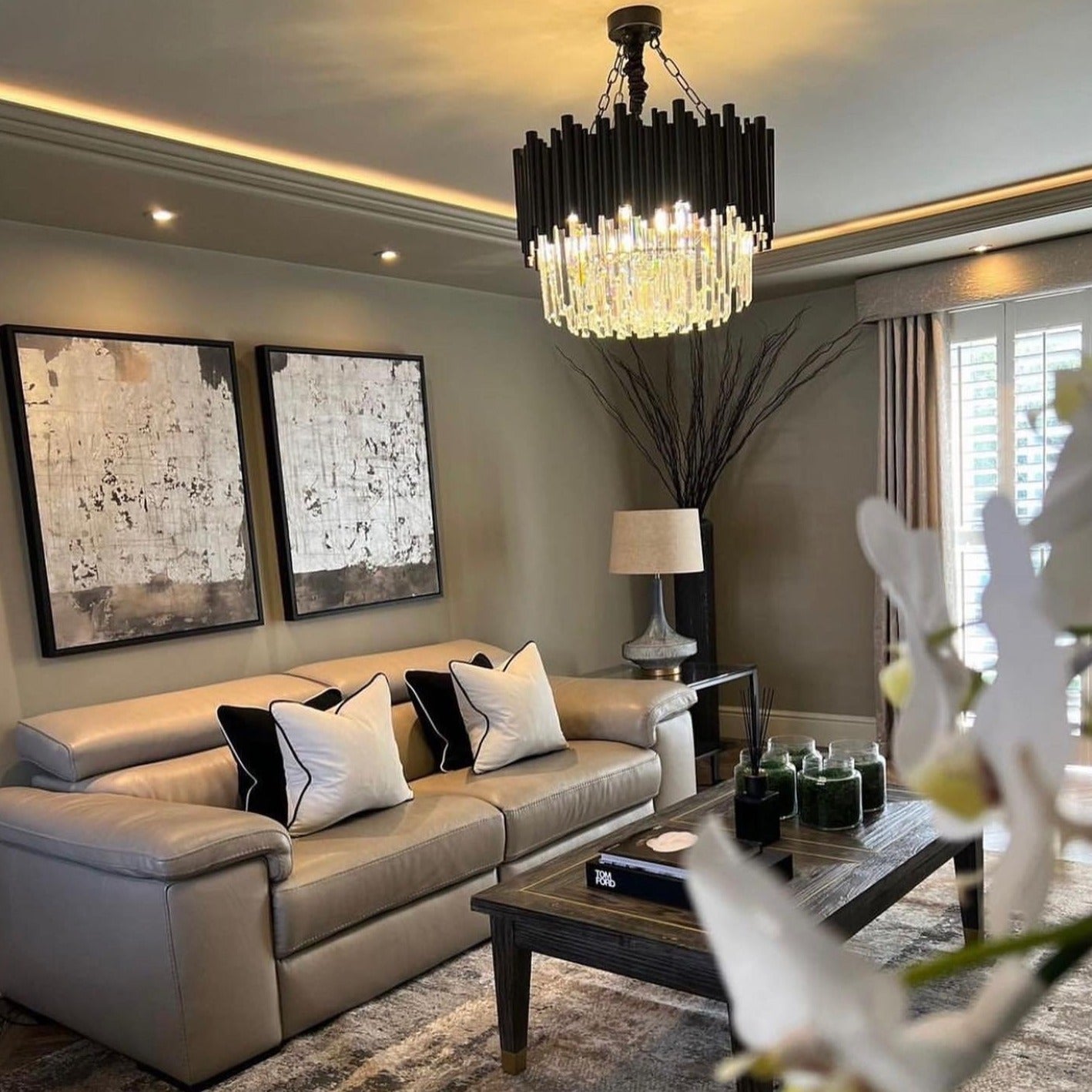 VORELLI® Gotham Circular Chandelier illuminating a luxury modern living room interior.