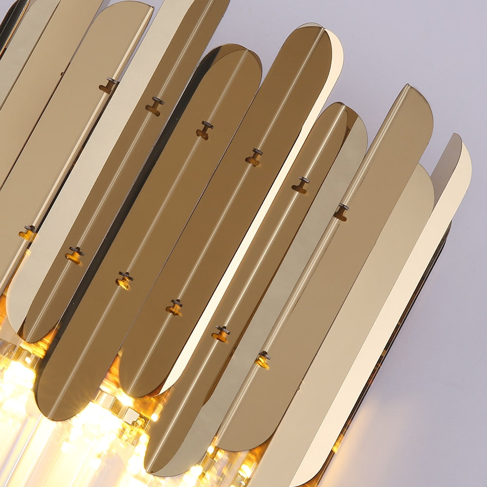 Detail of the decorative gold hexagon frame and crystal bar construction on the VORELLI Manhattan Wall Light
