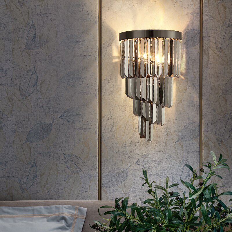 VORELLI Margoux wall light with cascading crystal bars creating warm ambient lighting in a refined luxury interior