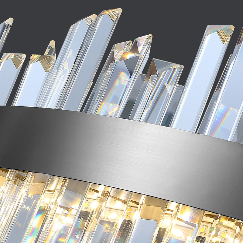 Close-up of vertical crystal bars rising from the stainless steel frame of the VORELLI Medina rectangular chandelier