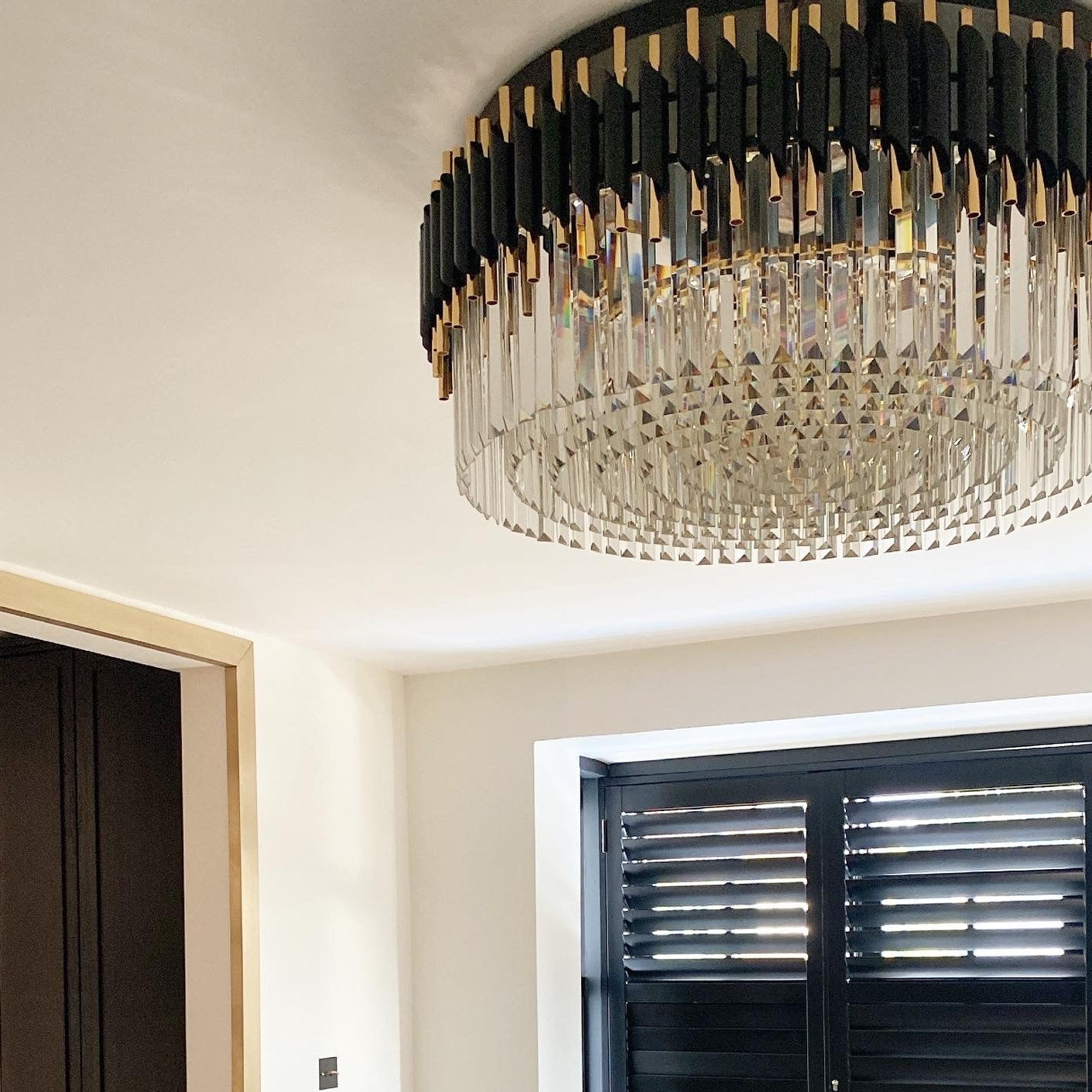 VORELLI Milltimber ceiling light with cylinder tubing and layered crystal bars installed in a modern luxury interior