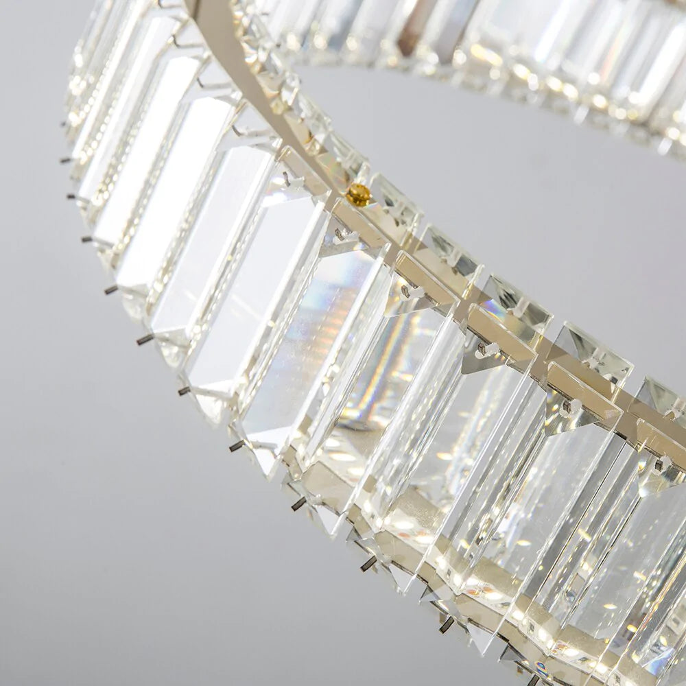Detailed view of circular halo frame and integrated crystal bars on VORELLI® Oia ring chandelier