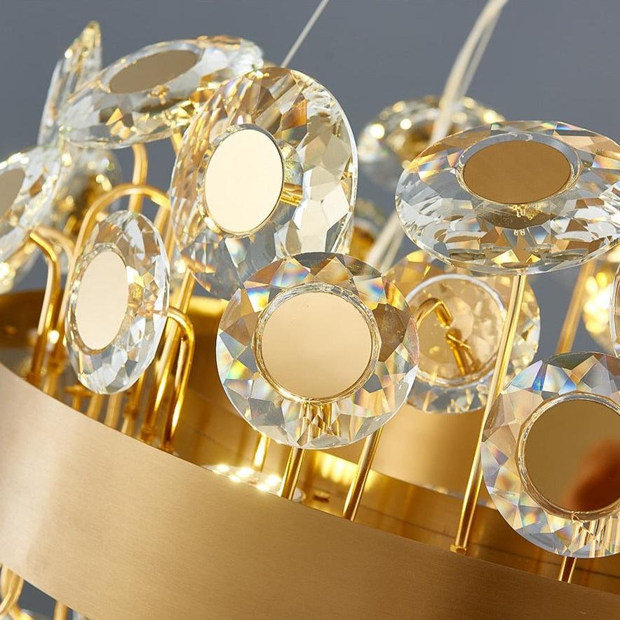 Close up of diamond cut crystal discs and circular metal detailing on VORELLI® Patara chandelier