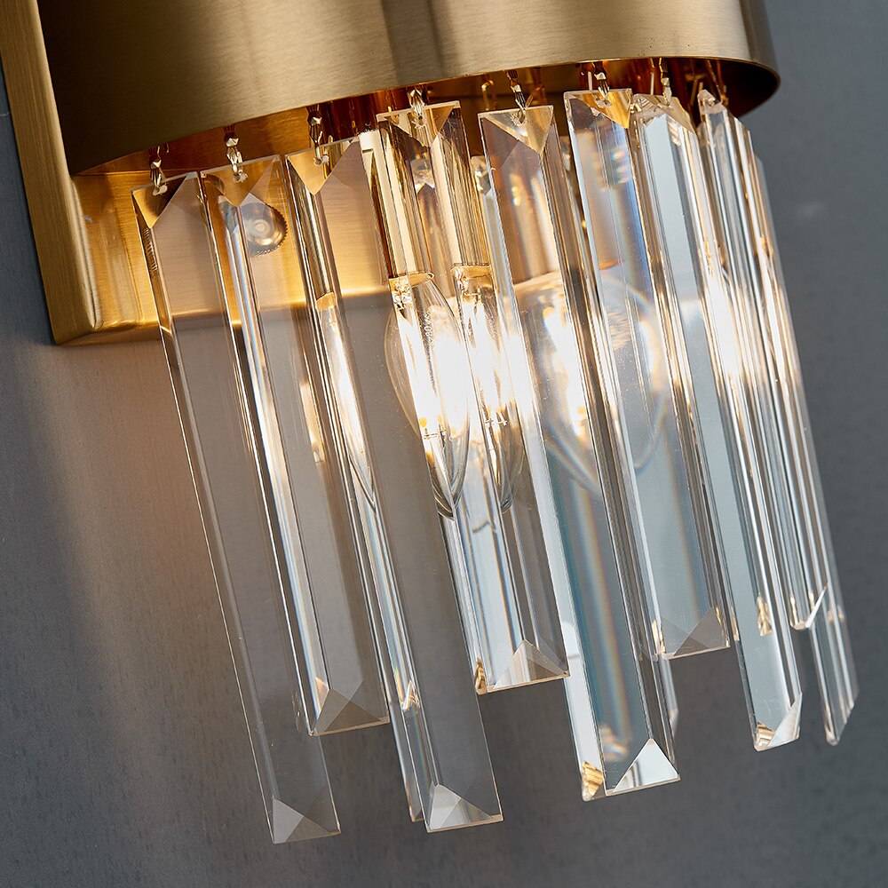 Detailed view of crystal elements beneath band frame on VORELLI® Patara Wall Light II