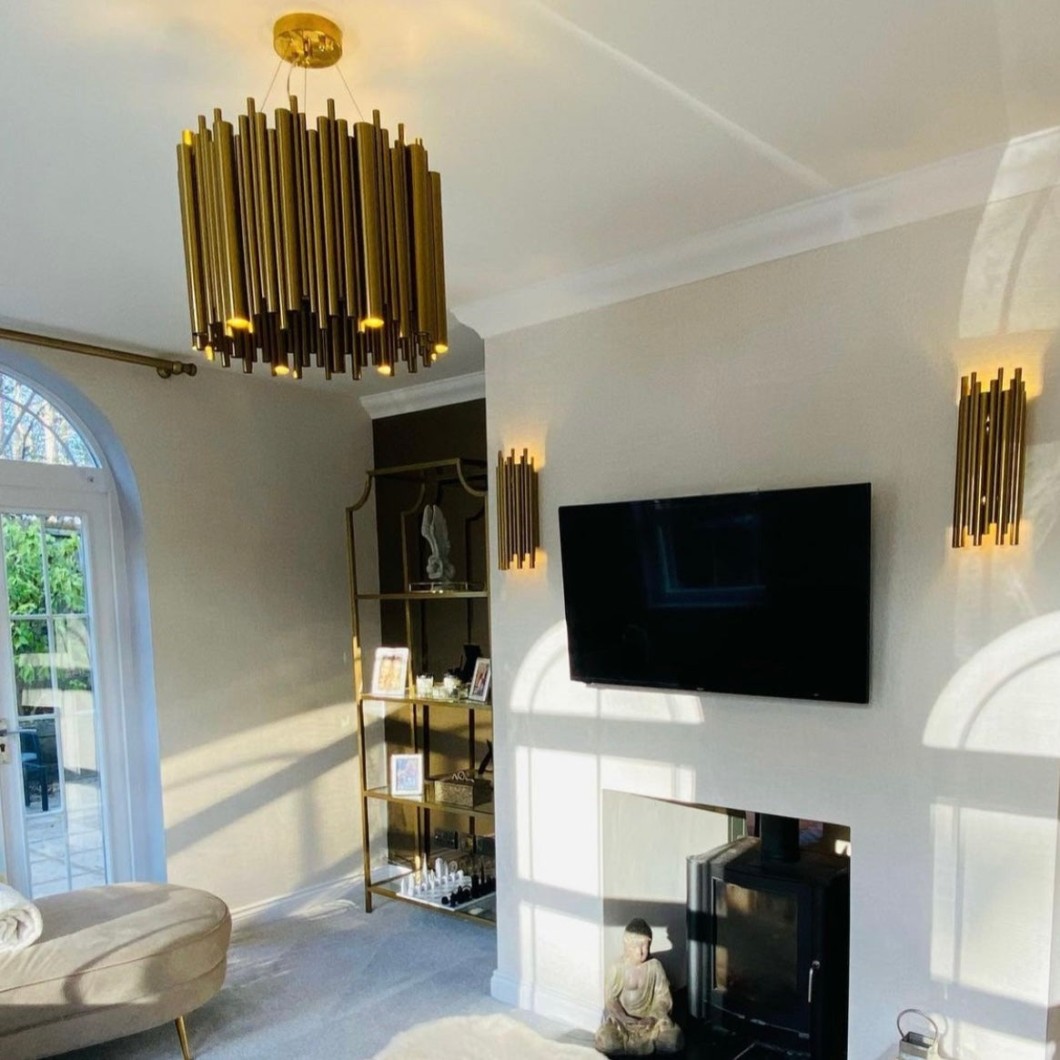 Detailed view of cylindrical tubes on luxury wall light creating layered lighting effect