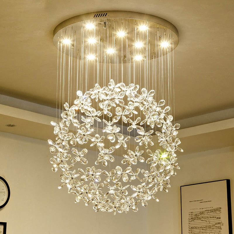 Whirlow staircase chandelier with diamond cut flower crystals forming a floating sphere design